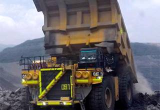 Unloading the Caterpillar Mining Truck on the Mine